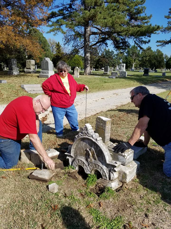 Volunteers rebuilding stone markers